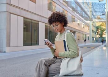A Women Checking Airtalk Wireless Application Status Using Smartphone Concept