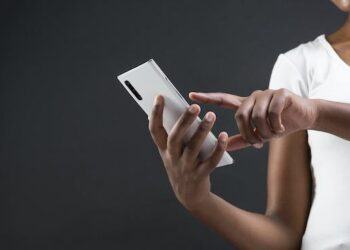 Woman Using Her Phone For Safelink Wireless Activation Concept